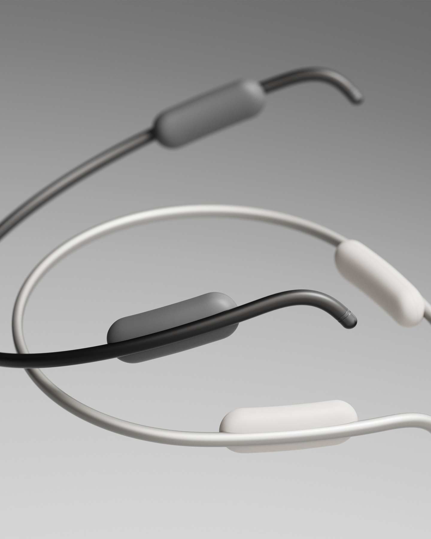 Macro view of the textured control modules on the ends of the Clay AI wearable neckband