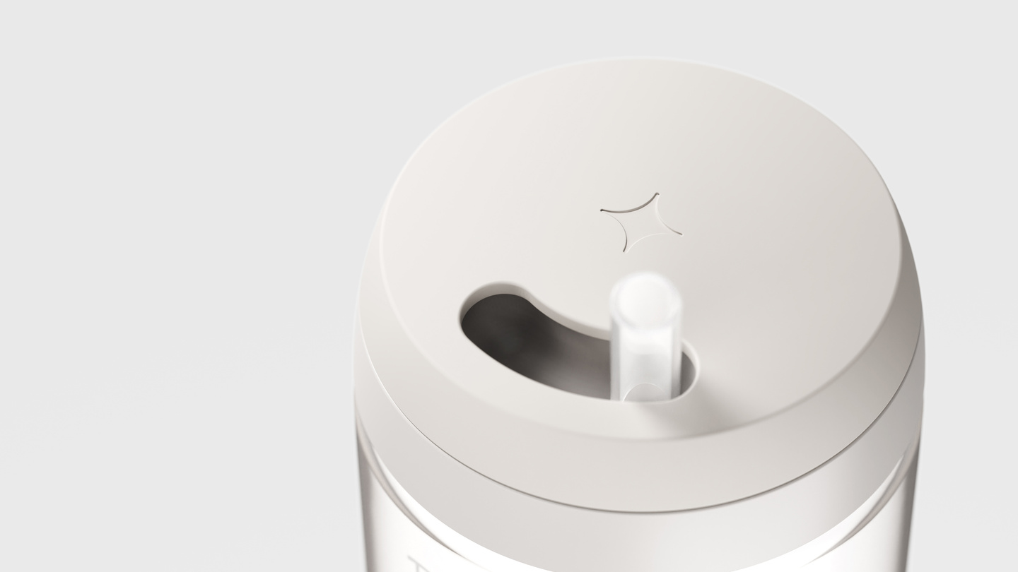 Overhead view of a white cup lid with extended straw