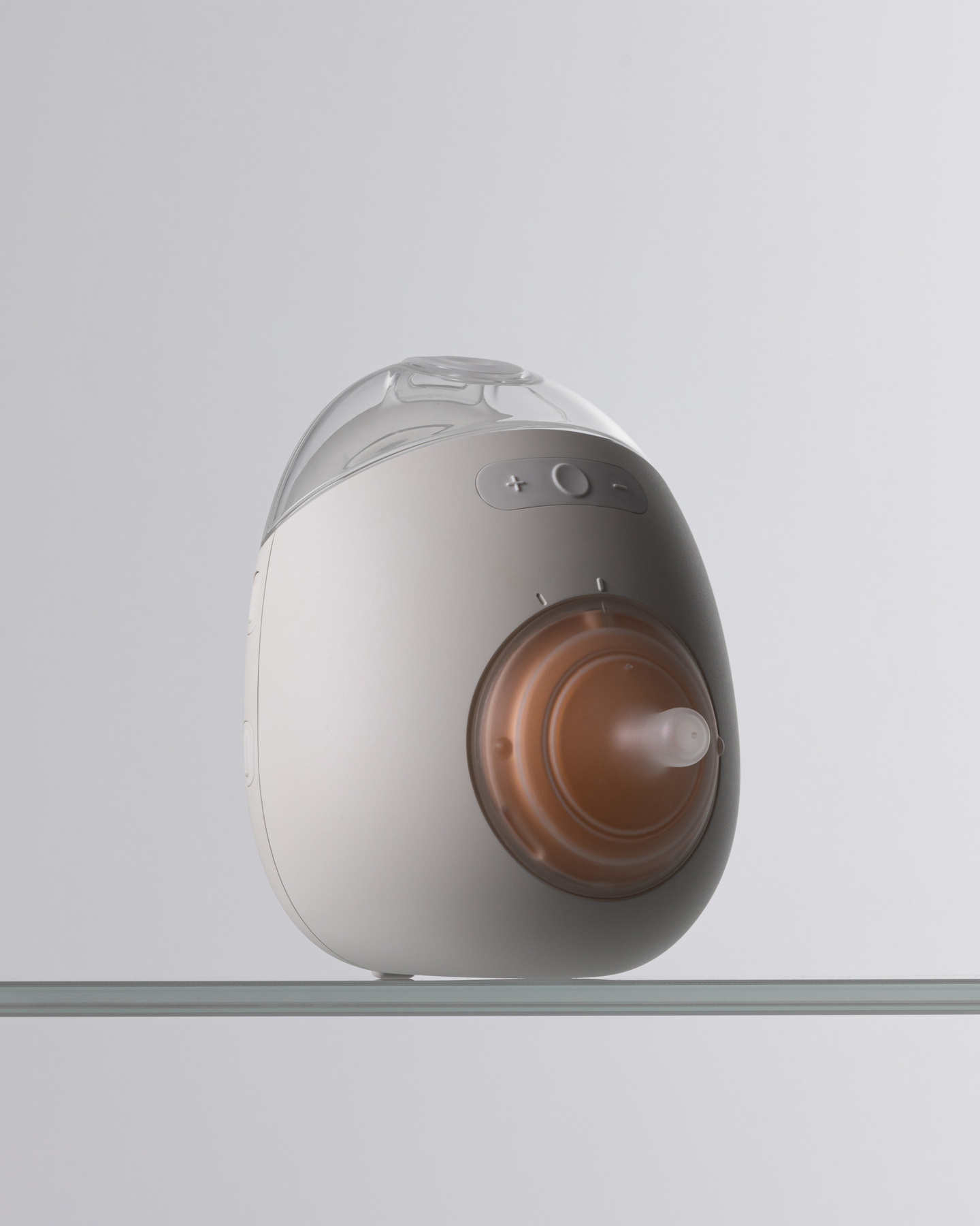 Studio profile shot of the white Avira breast pump unit.