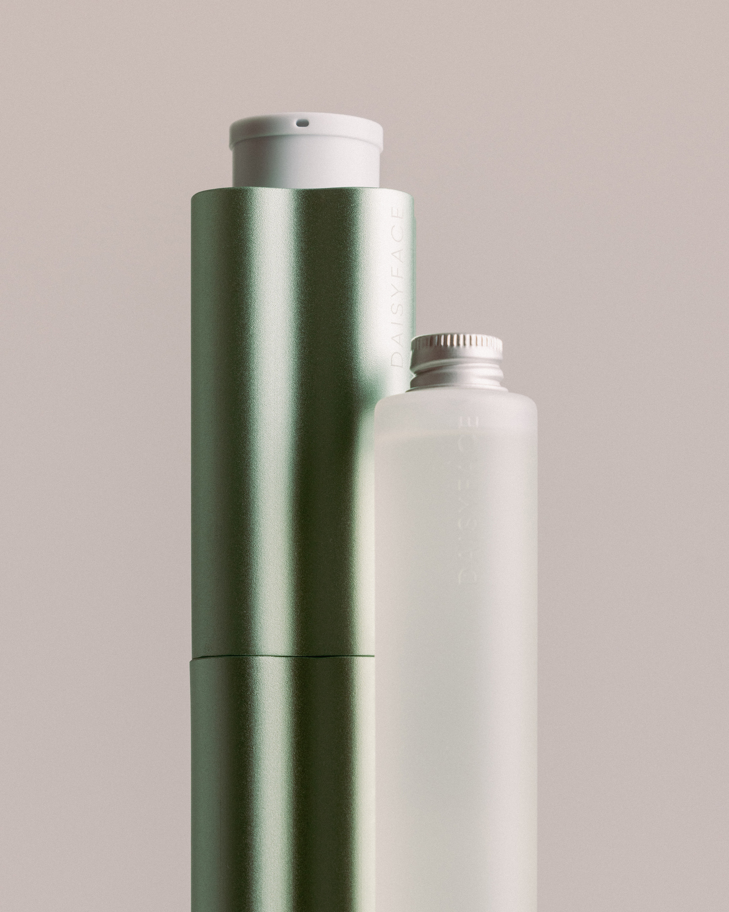 Inset view of a slender metallic bottle with cap