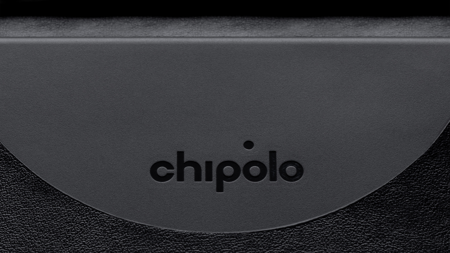 Detailed close-up of dark textured plastic surface showing the Chipolo logo.