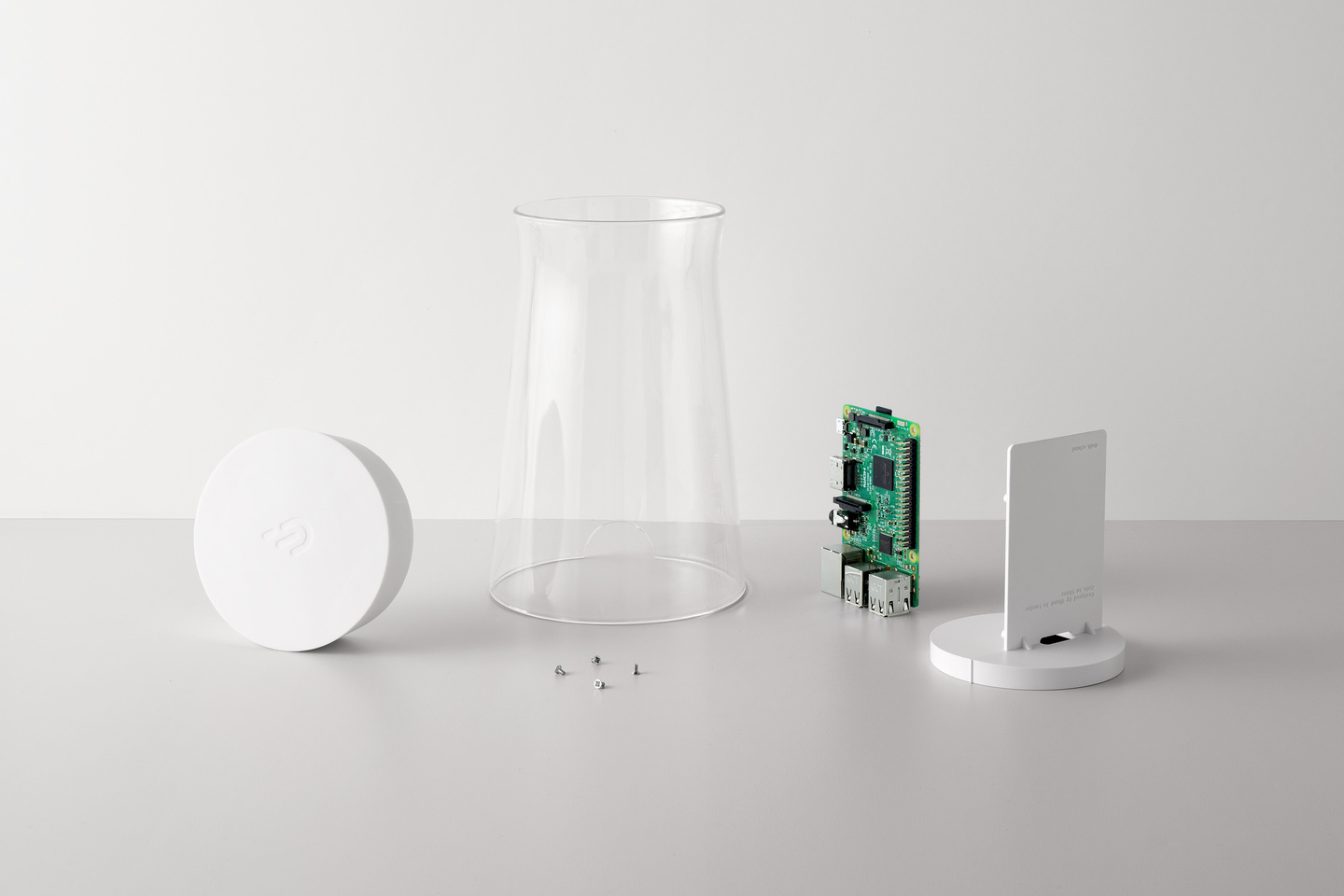 Disassembled node unit components placed side-by-side on a white surface.