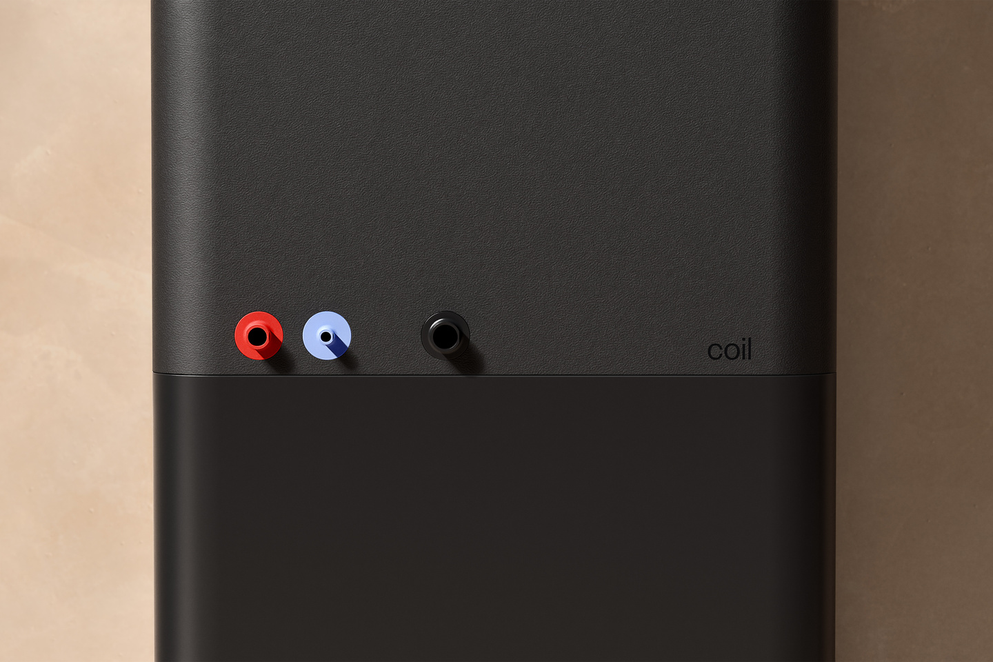 Close-up view of connection ports and detail on a black HVAC unit