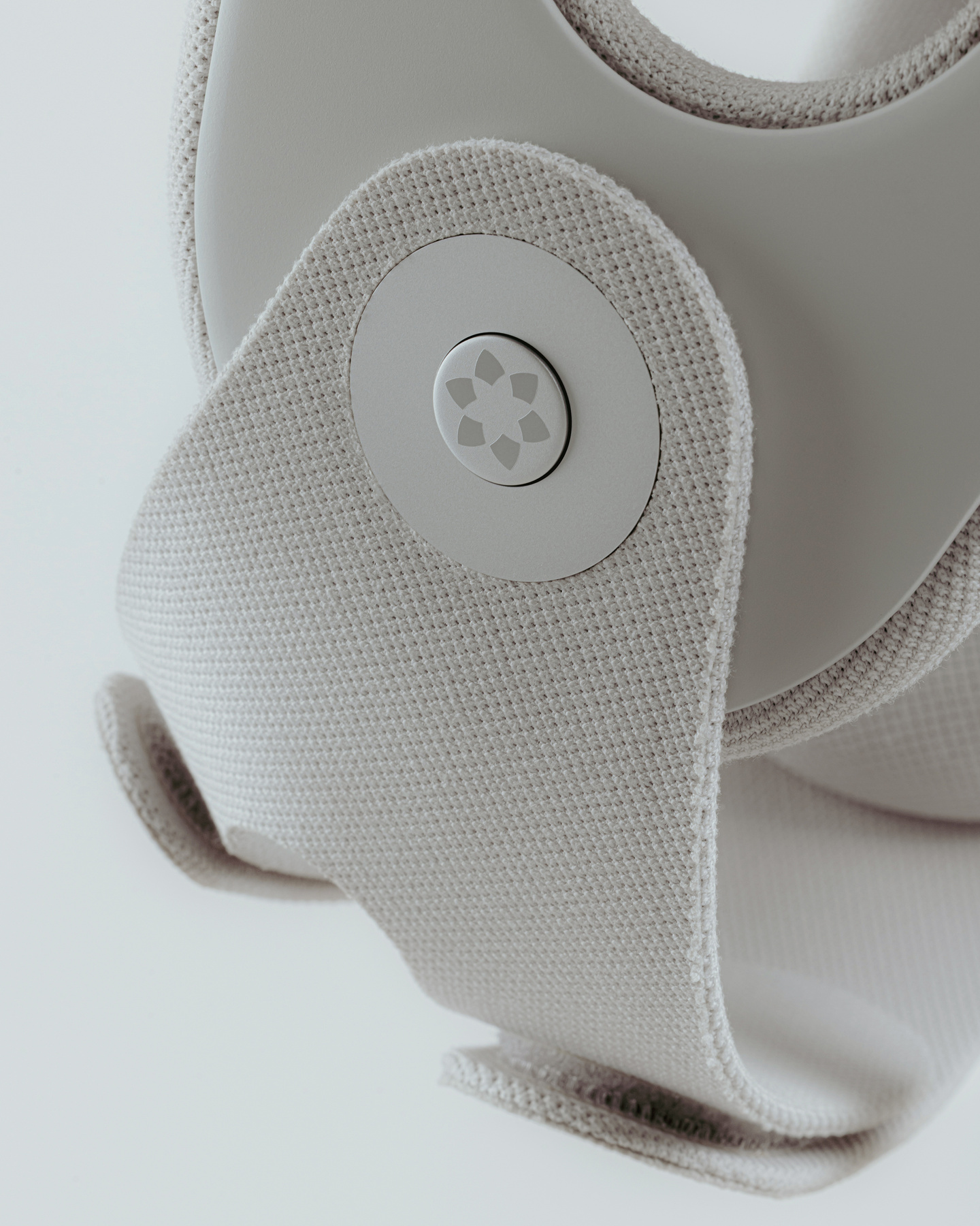 Detailed view of textured grey strap assembly showing attachment points