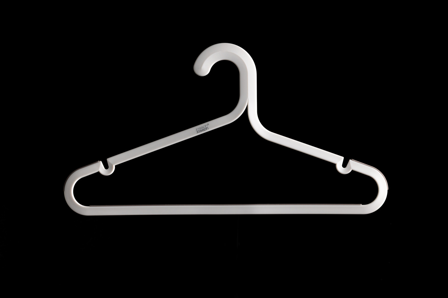 White wireframe outline of a coat hanger on a black background