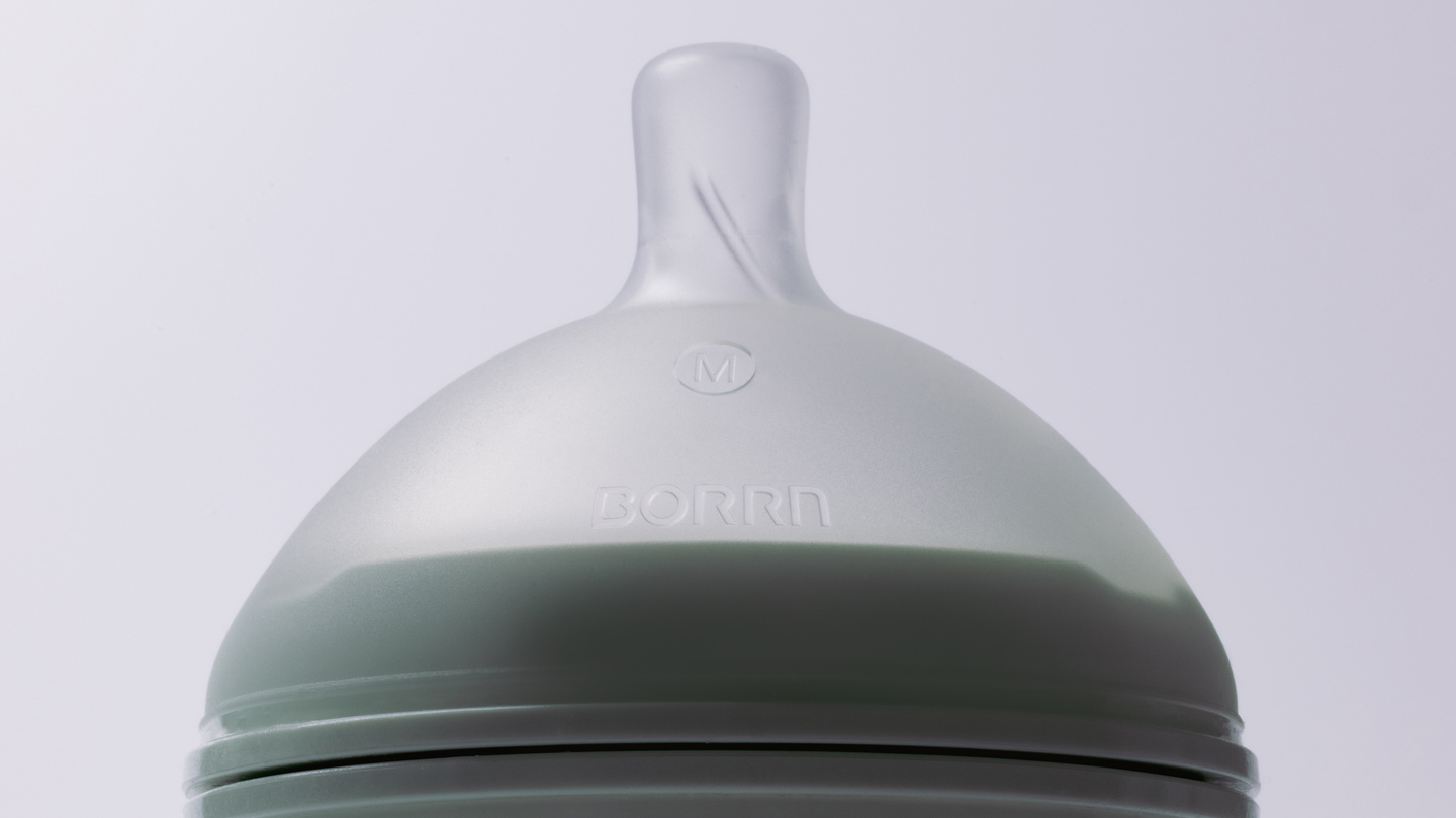 Detail view of a clear white silicone feeding bottle teat.