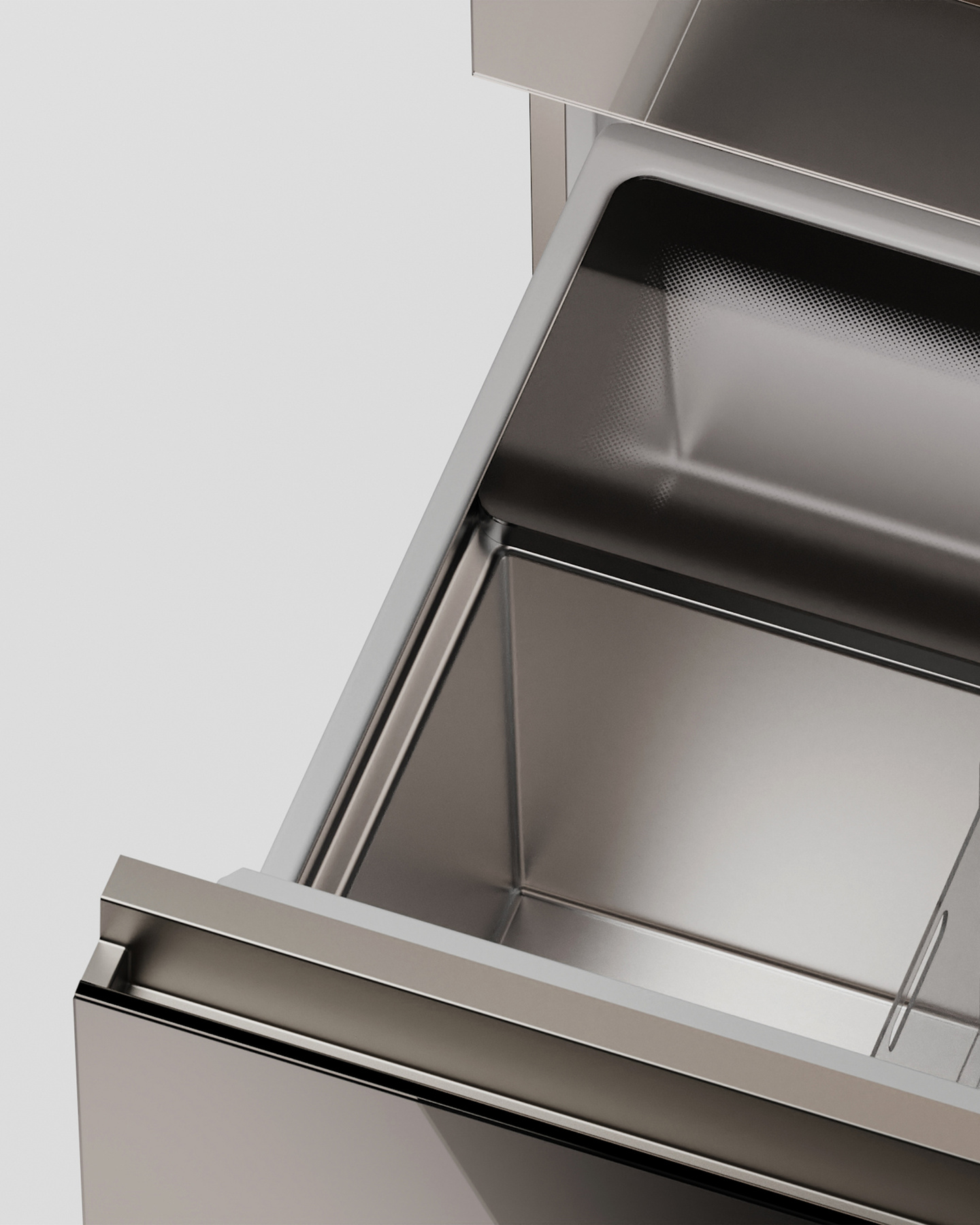Stainless steel appliance drawer interior showing metallic bin compartments