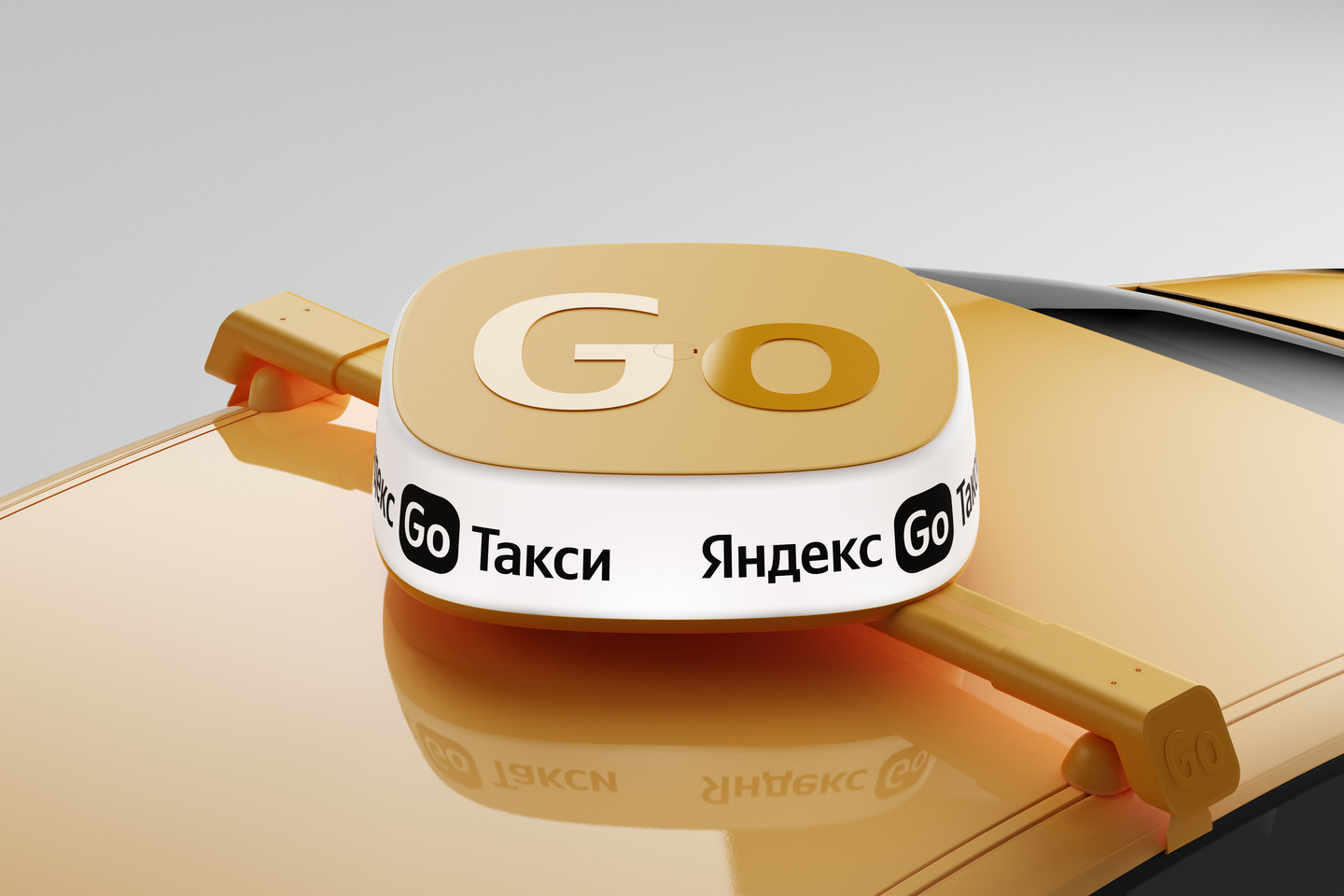 Close-up view of a yellow Yandex Go rooftop lightbox mounted on a car roof