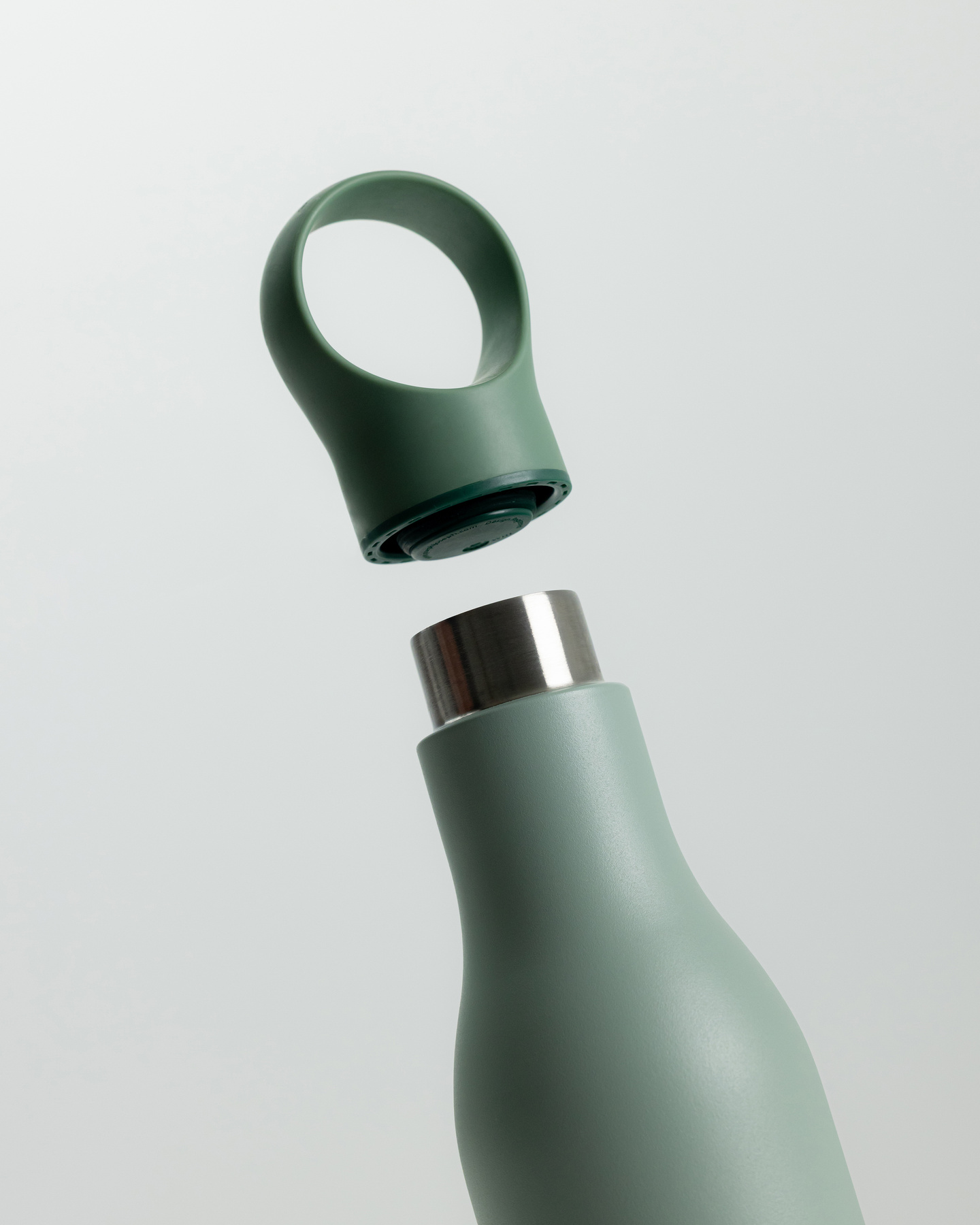Small view of a green water bottle with integrated loop cap