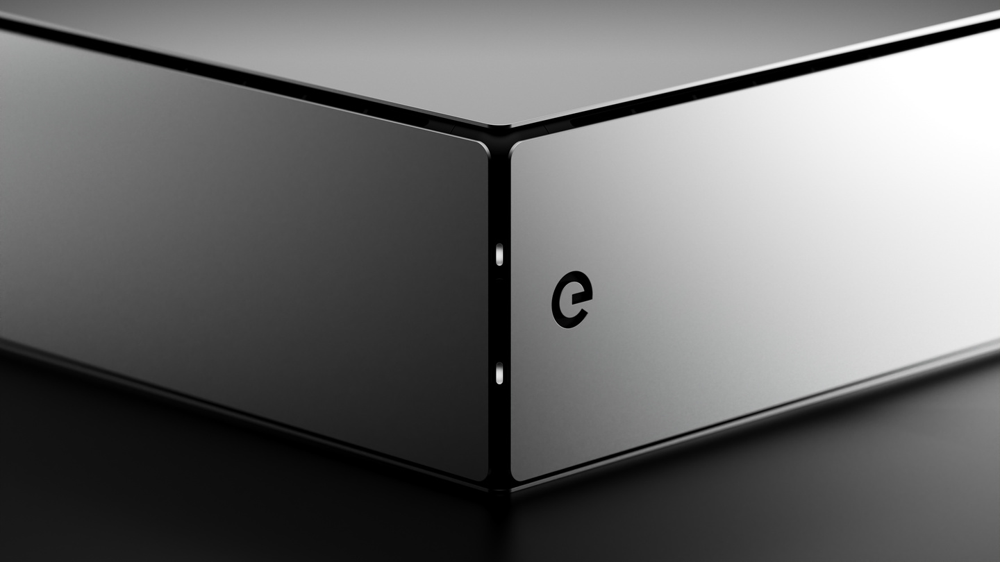 Corner detail render of dark grey metallic electronic hardware enclosure on dark backdrop