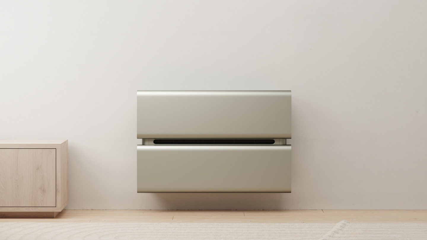 Wall-mounted air conditioner installed above a low shelf in a minimalist room.