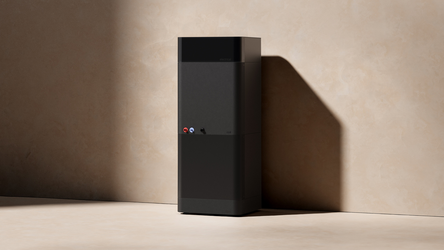 Black vertical tower HVAC unit standing on a light floor with wall shadows