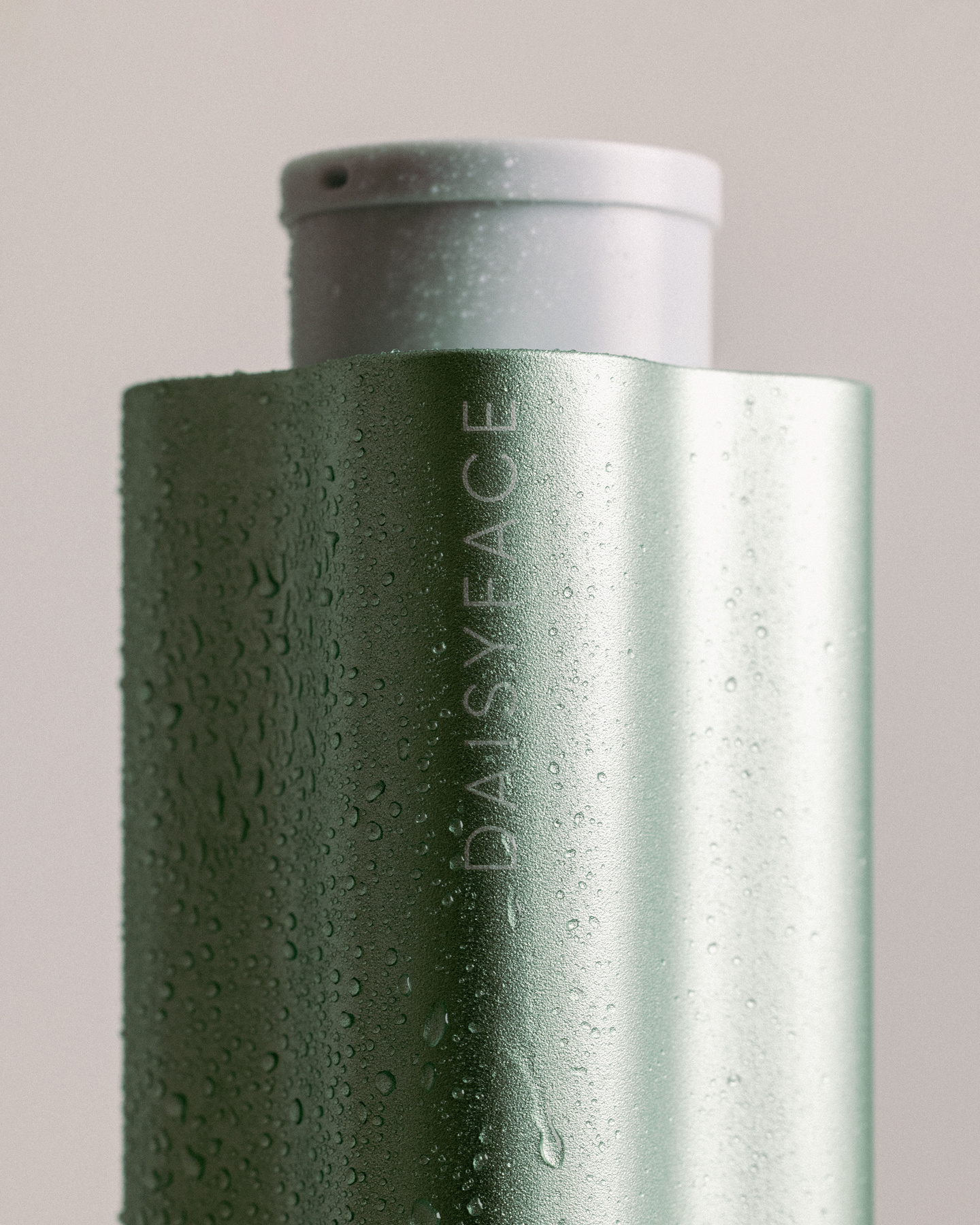 Small inset view of a metallic bottle cap