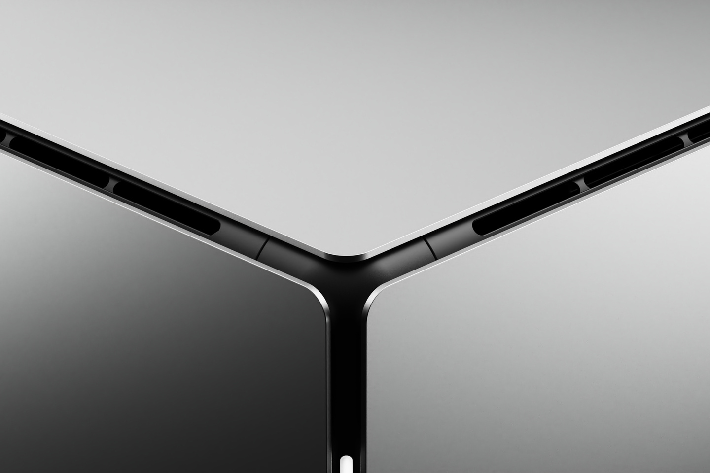 Detailed close-up view of seamless corner joint construction on dark metallic enclosure