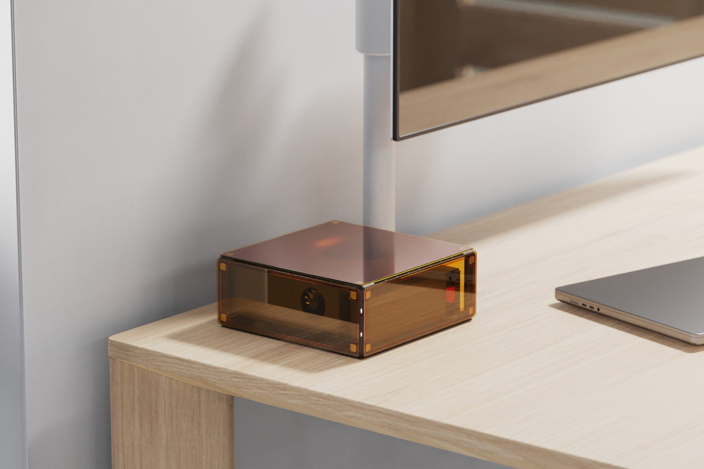Minimalist workspace desk setup featuring hardware device on wooden surface