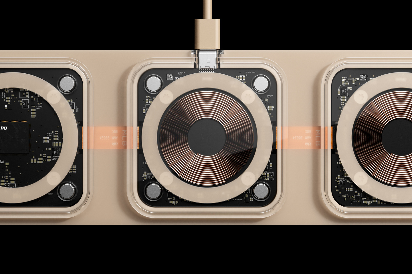 Close-up view of charging pad surfaces showing copper induction coils and power connection.