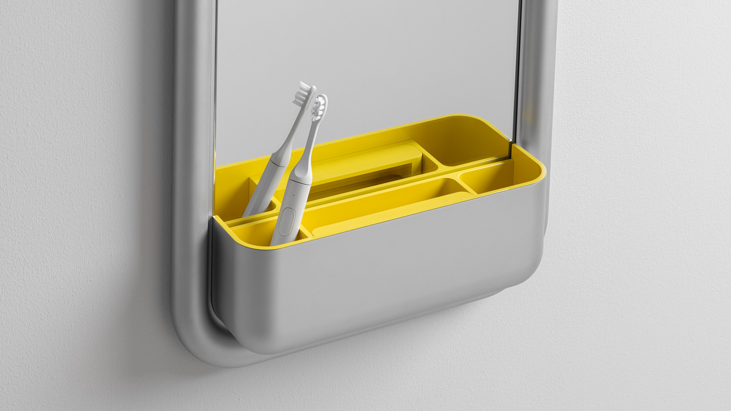 Front view of a wall unit tray with yellow compartmentalised slot holding small tools