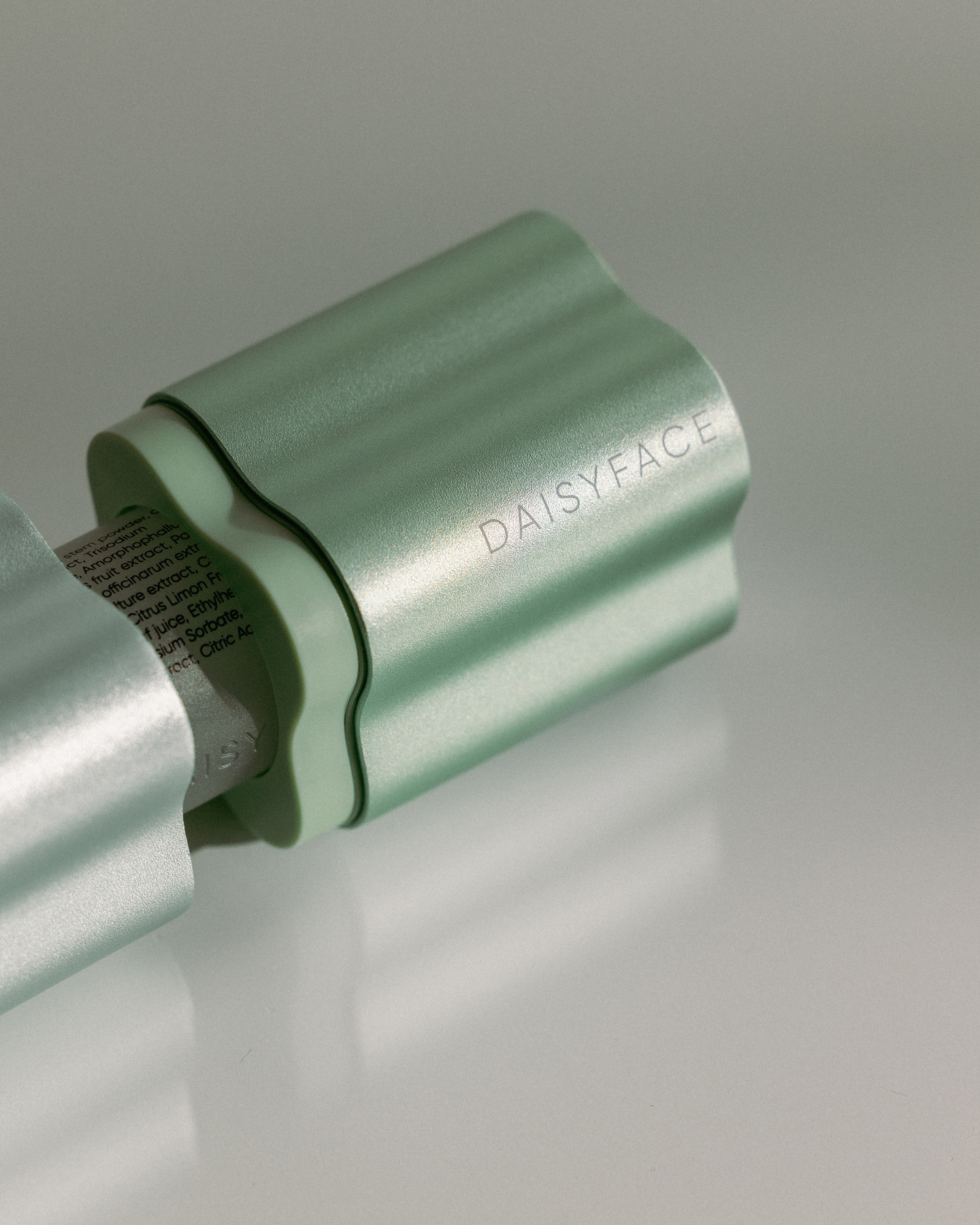Detailed close-up view of a green fluted bottle cap