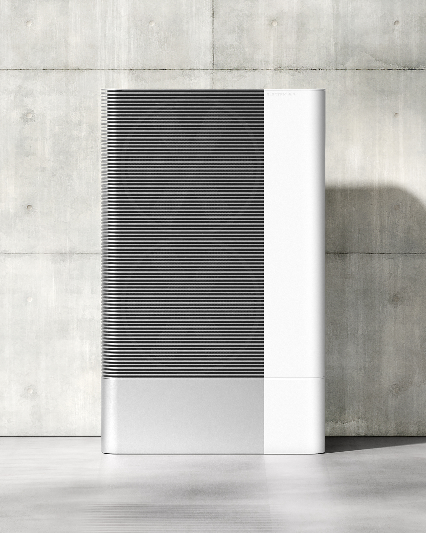 Dark grey outdoor HVAC heat pump unit standing against a concrete wall
