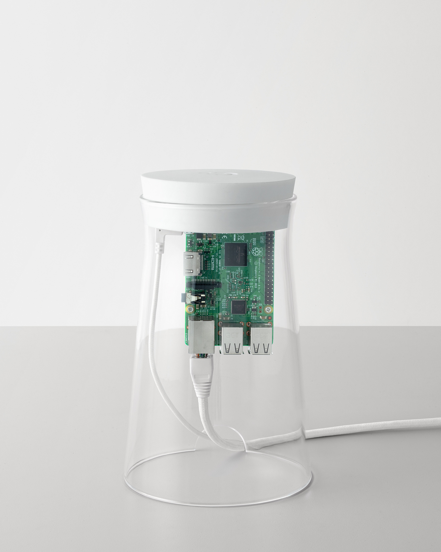 Fully assembled glass cylinder node unit resting on a plain surface.