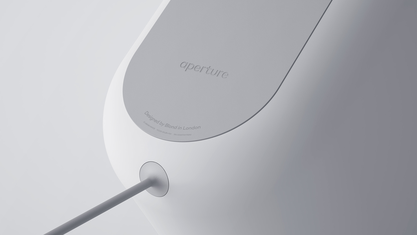 Close-up view of paper feeding into a sleek white paper shredder slot