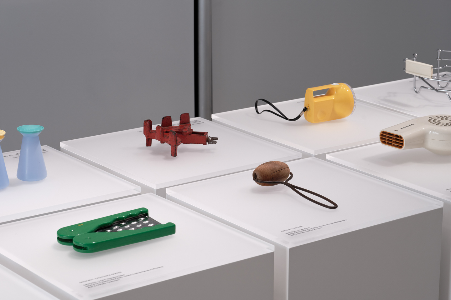 Several metallic modular hardware components resting on white surface