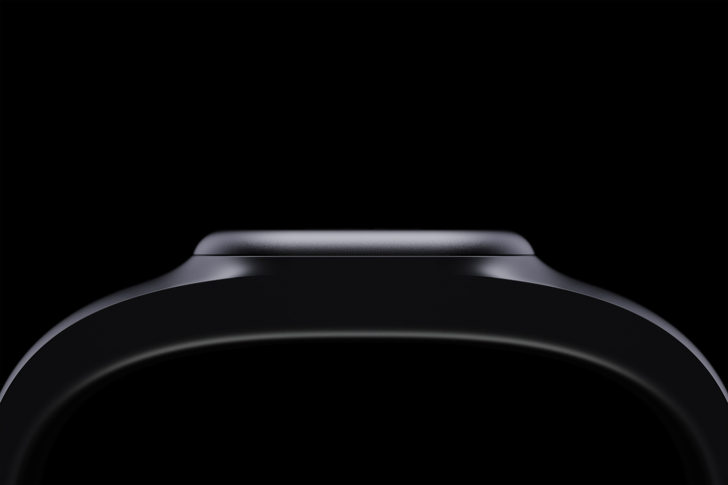 Close-up view of a dark sleek wearable device band on black background