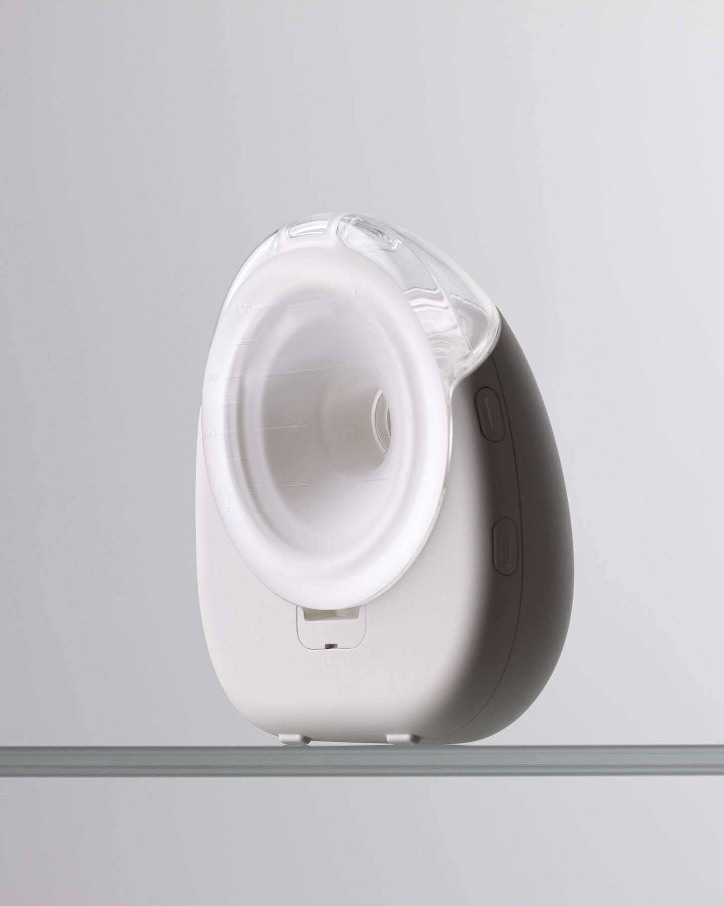 Rear view shot of the white Avira breast pump showing the internal funnel.