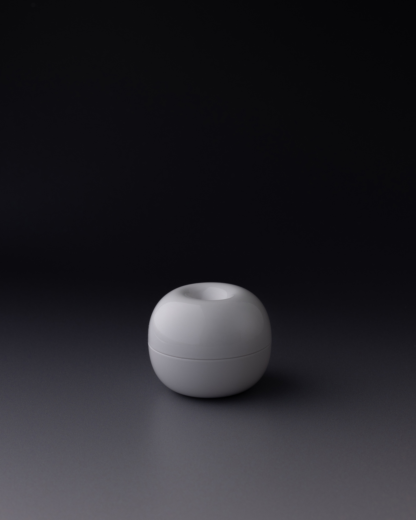 Small round spherical base component resting on a surface