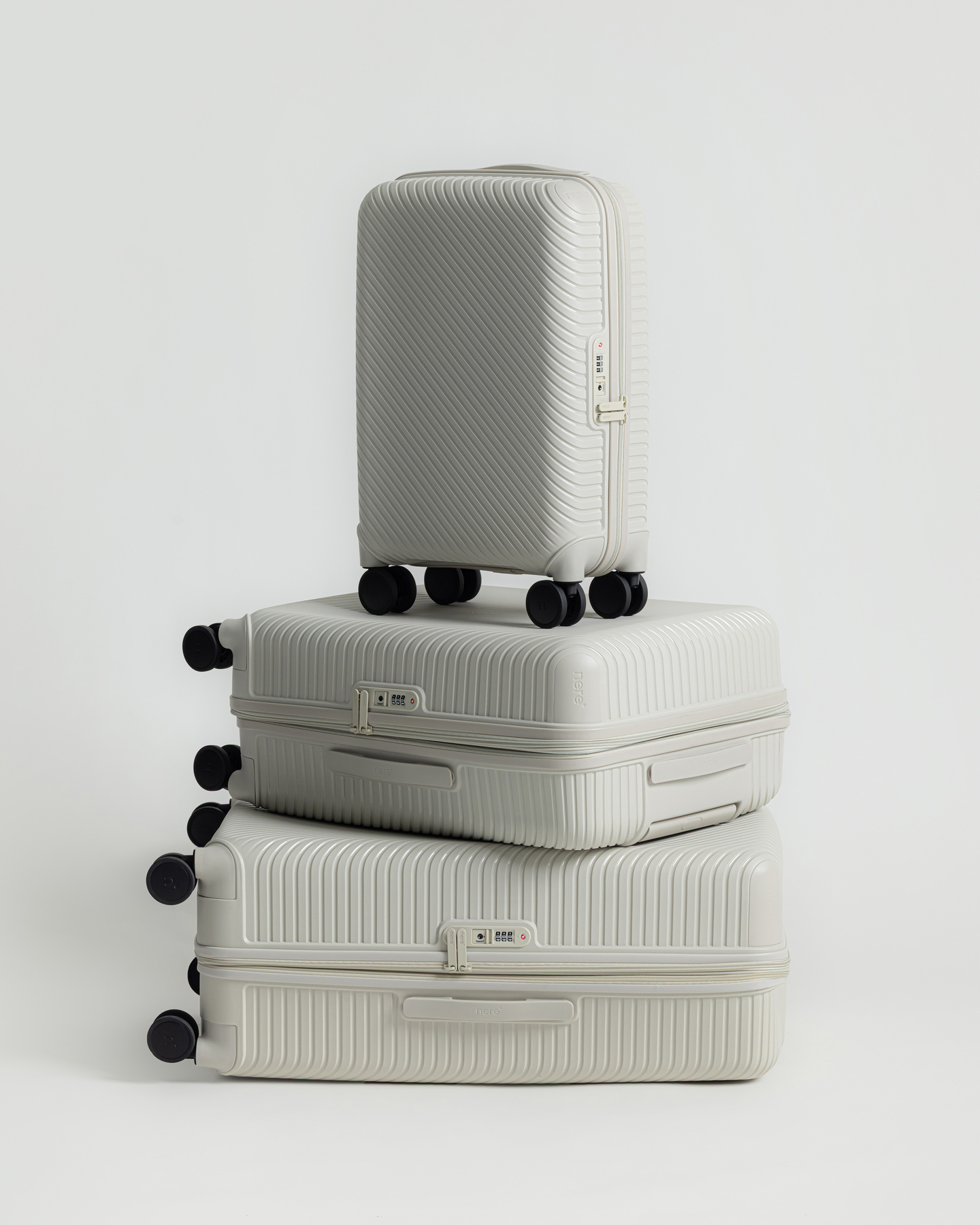 Inset view of stacked hardshell suitcases