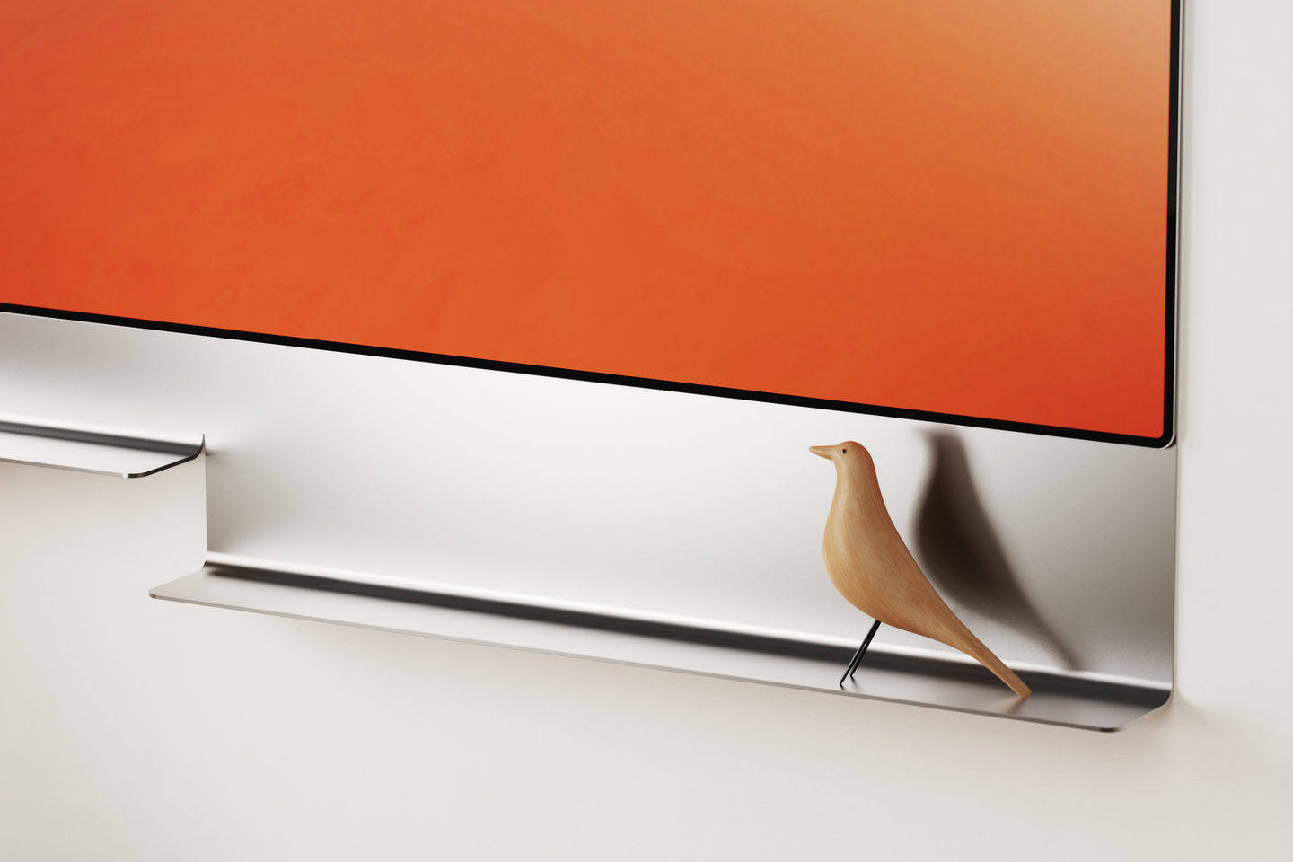Close-up of wall-mounted television base and lower bezel.