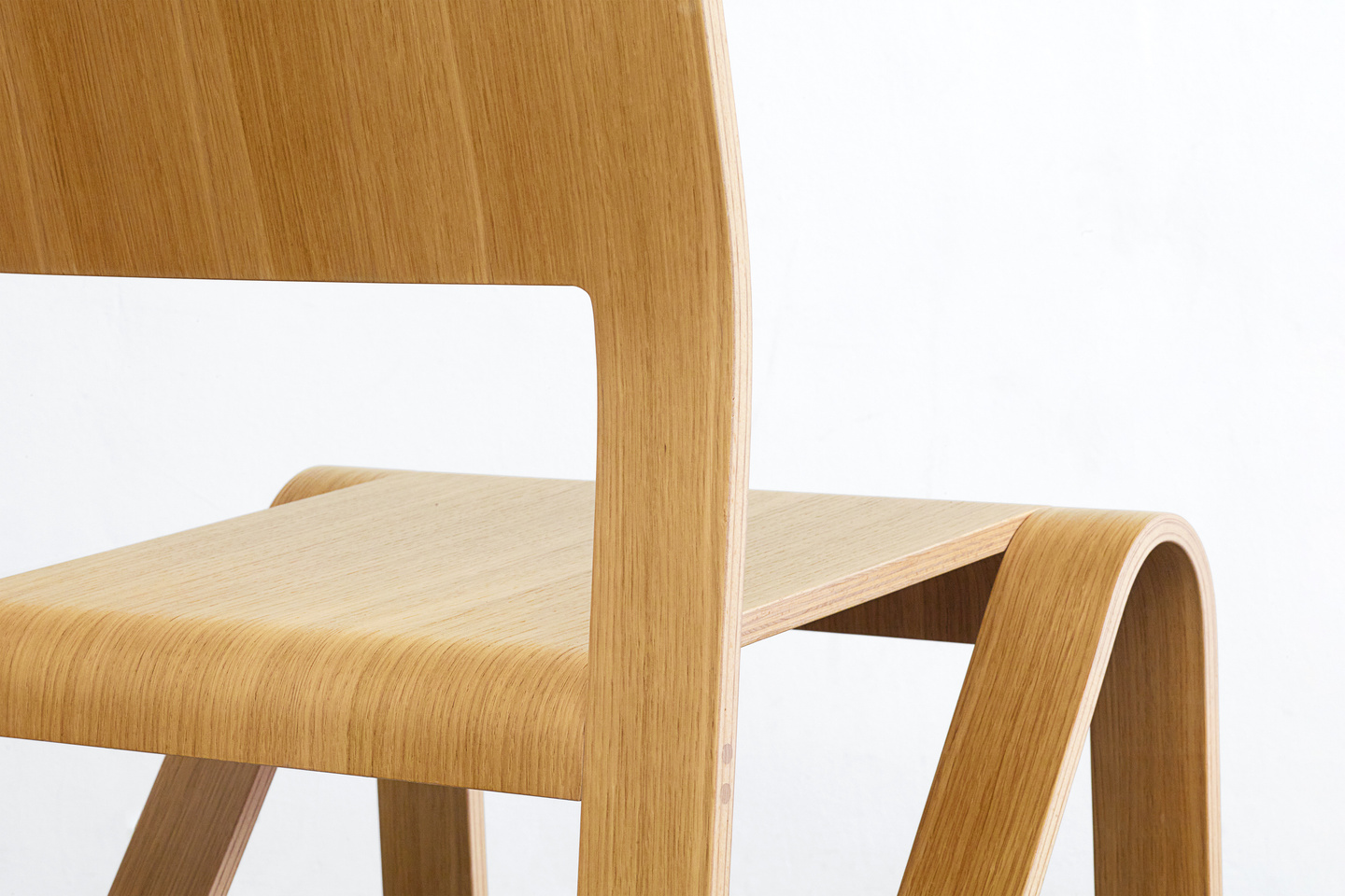 Close-up detail view of the wooden chair backrest and frame joint construction.