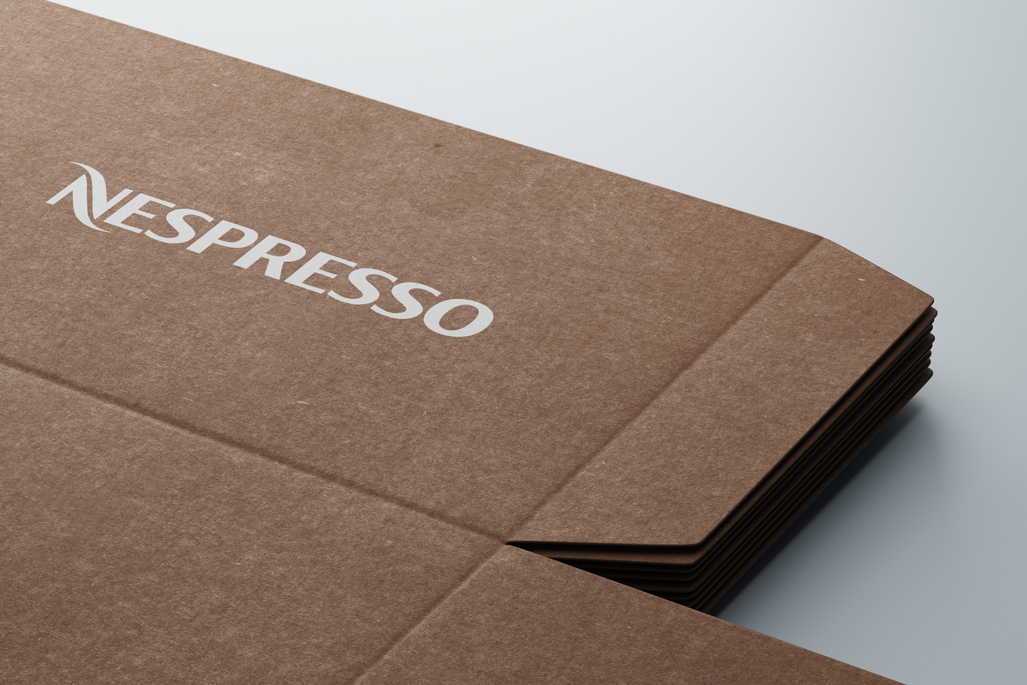 Brown cardboard packaging flap printed with white wordmark