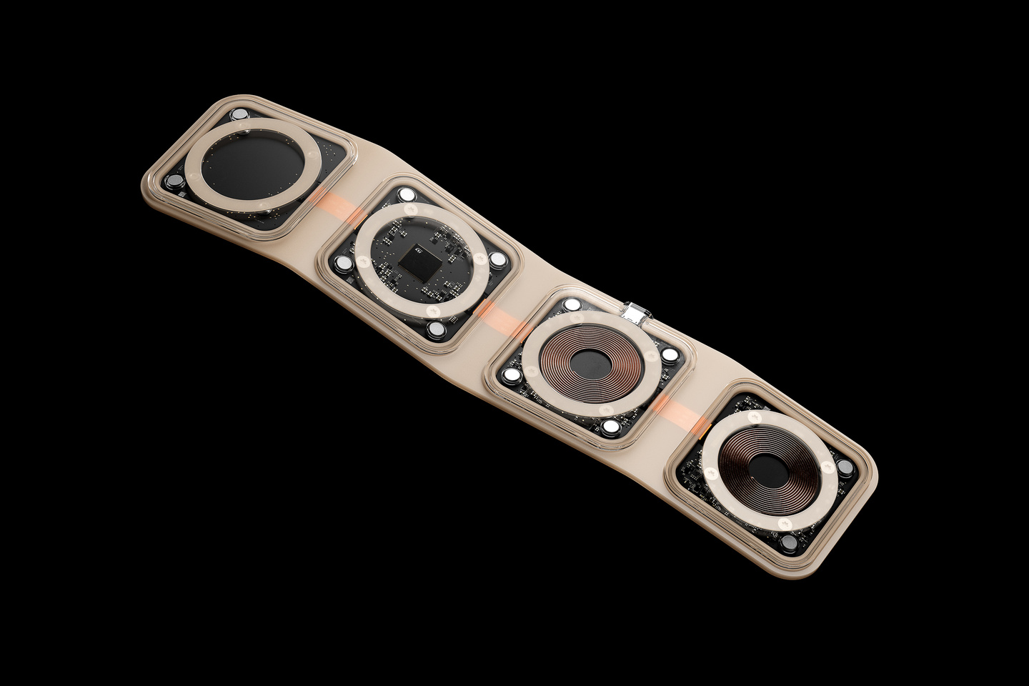 Small angled view of an unfolded four-pad wireless charger on a black background.