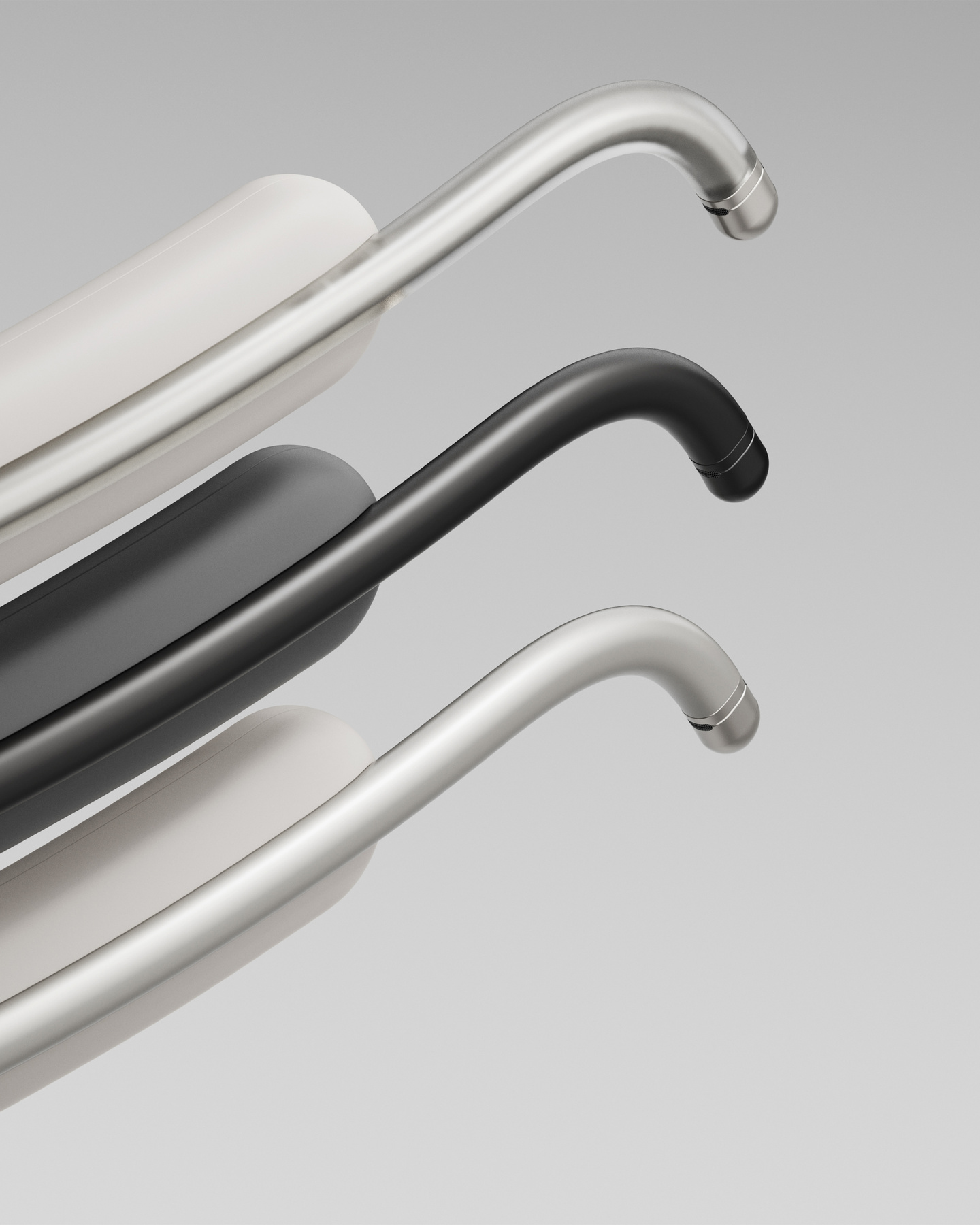 Close-up view of three stacked Clay AI wearable neckband modules in light grey, black, and white