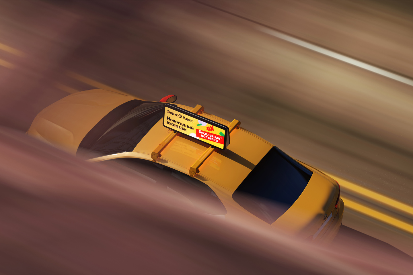 High-angle shot of a yellow taxi driving along a city street