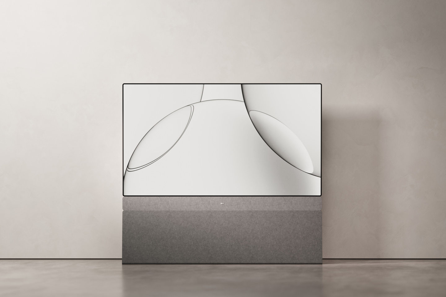Front view of television standing against a neutral grey wall.