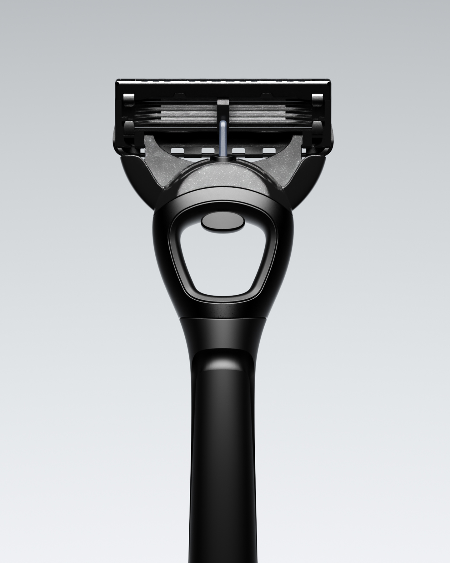 Black razor handle and blade cartridge head standing against a light grey background