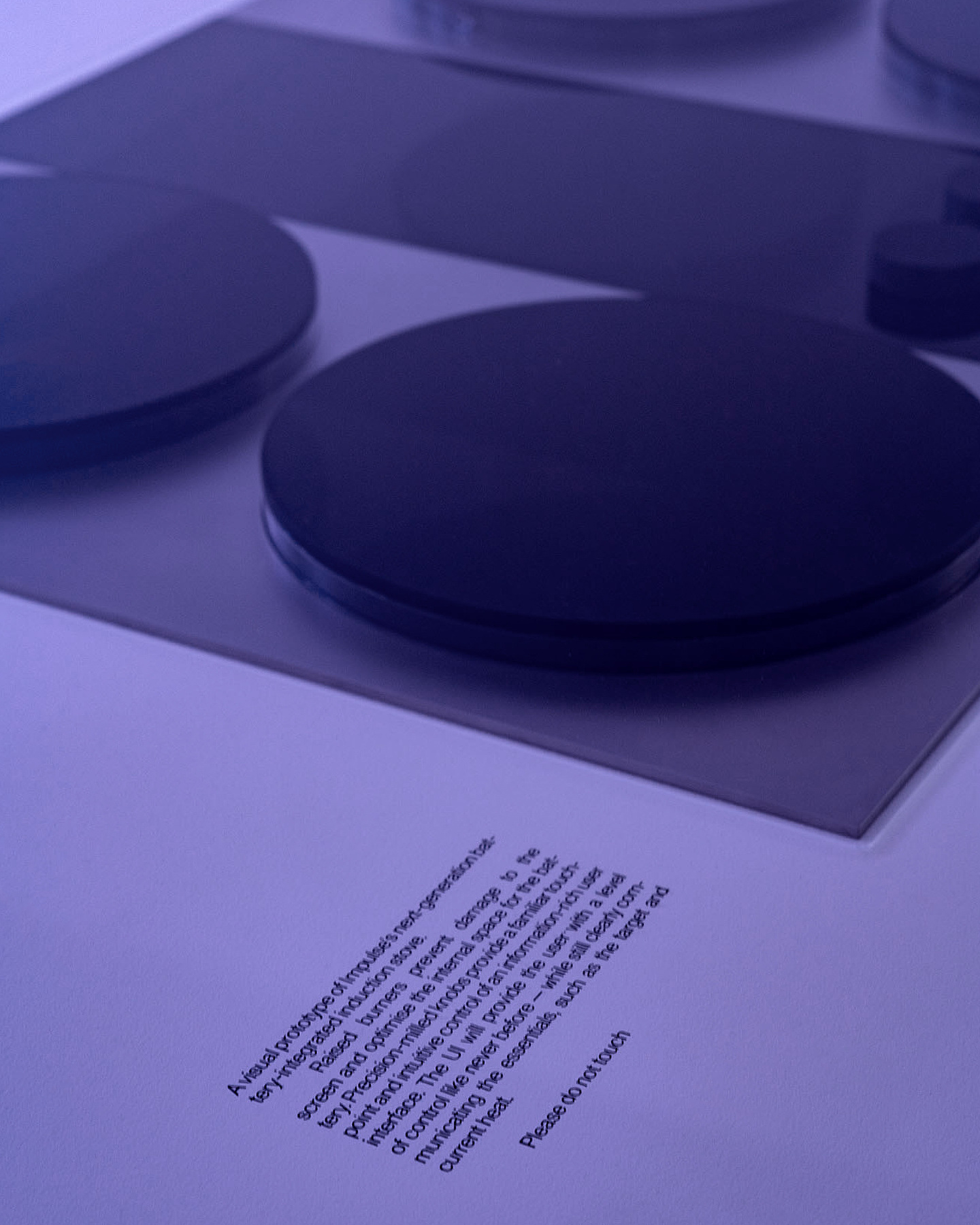 Close-up of an illuminated purple object on a dark background.