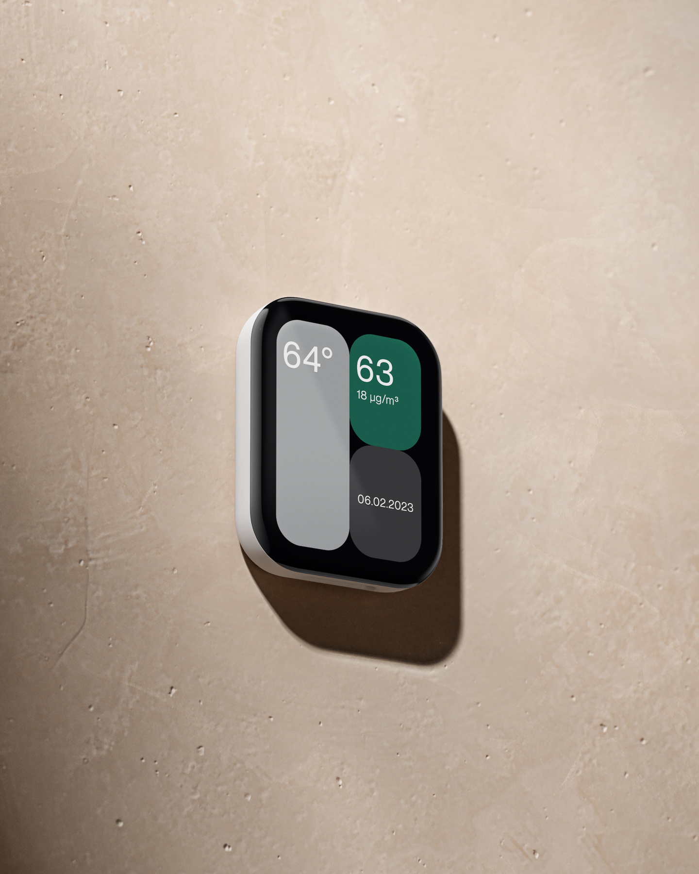 Square wall-mounted digital controller unit resting on a light floor surface