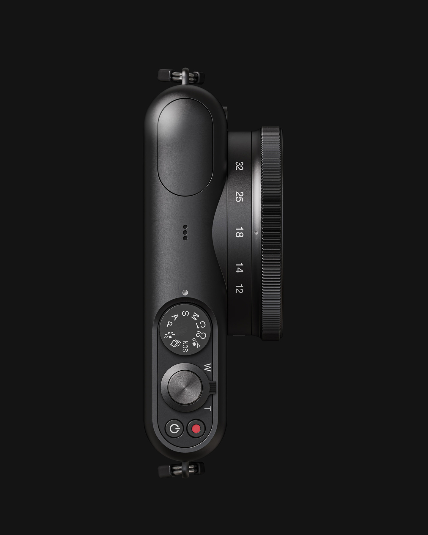 Top-down view of a black camera body with lens barrel against a dark background