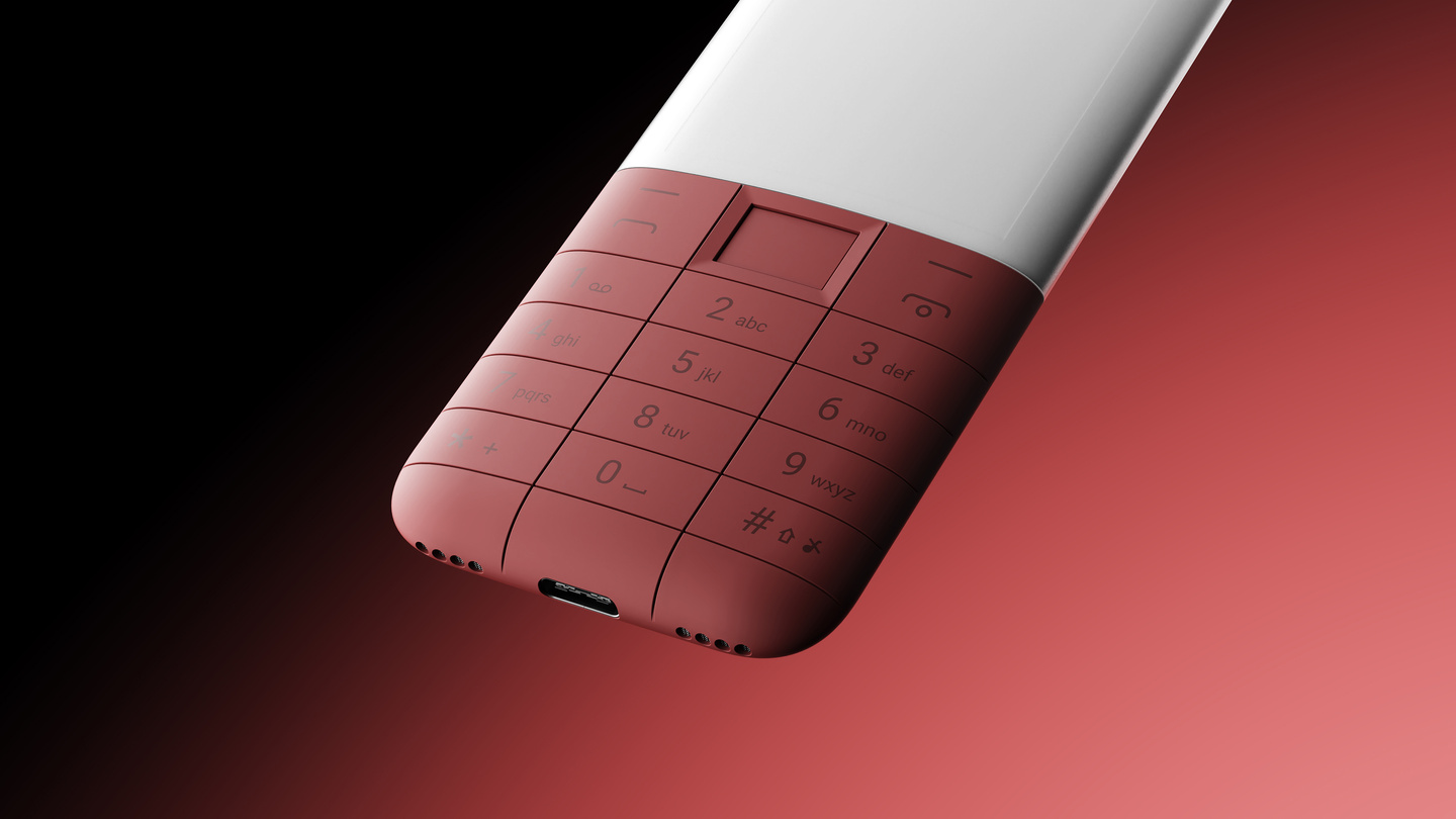 Close-up detail of a terracotta-coloured textured keypad section of the phone.