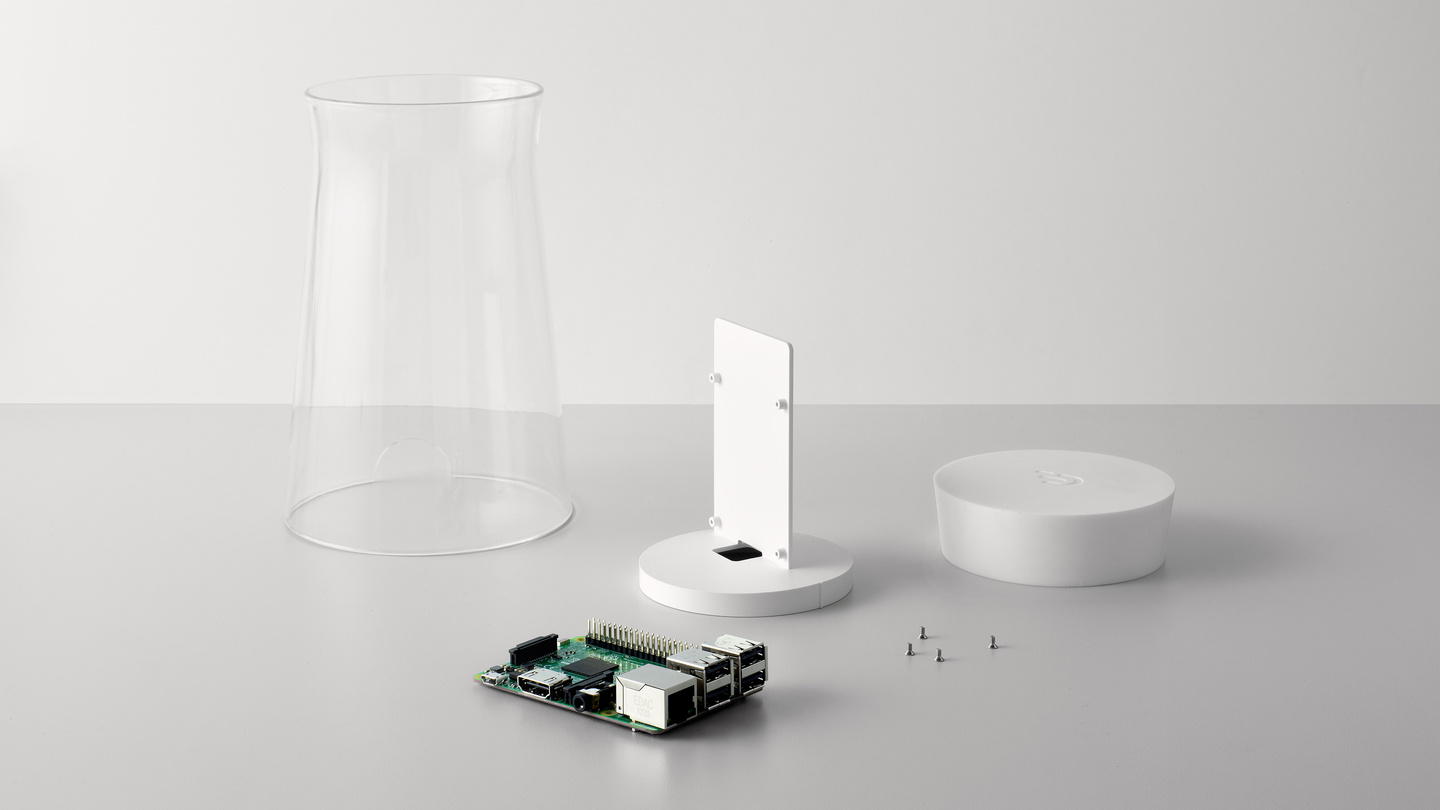 Disassembled parts of the node unit including glass tube and circuit board.