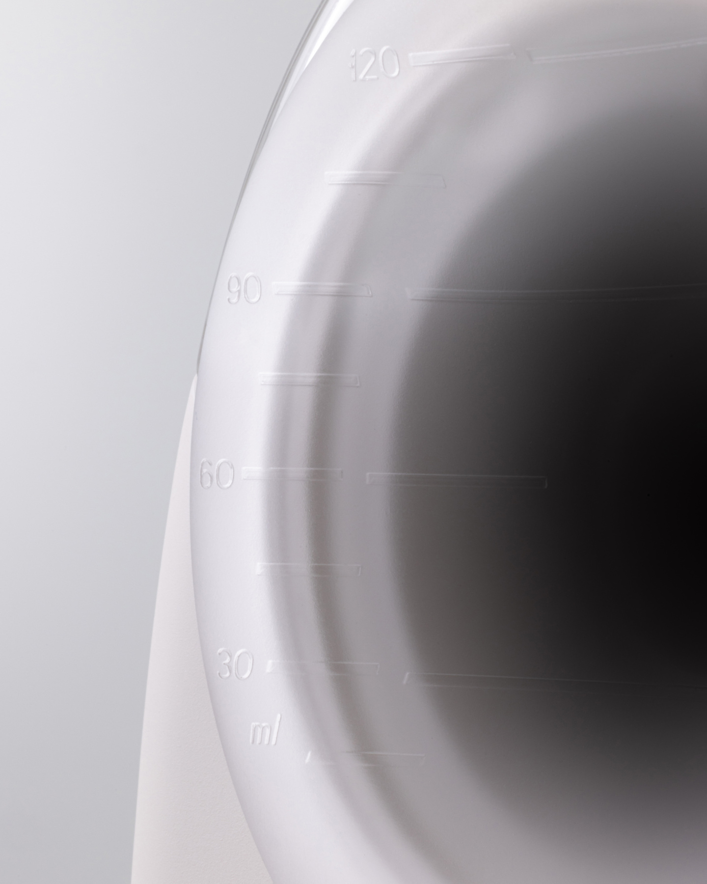 Close-up view of the translucent plastic cover shell of the breast pump.