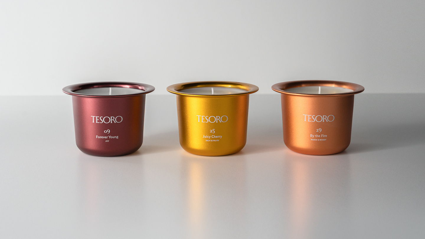 Three metallic candle refill inserts in red, gold, and bronze tones