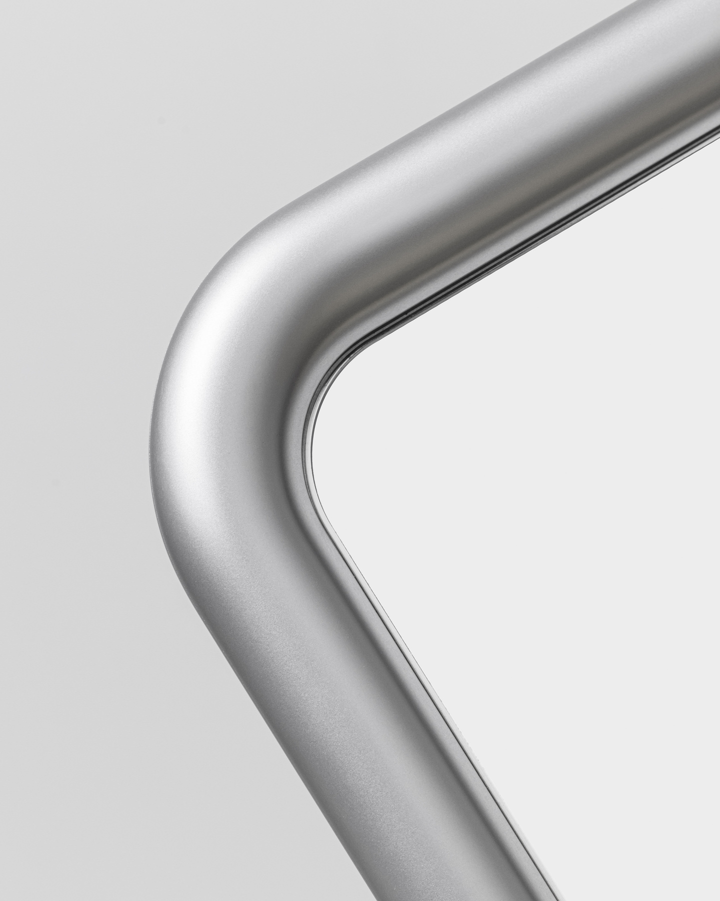 Detailed view of a tubular curved metallic frame component