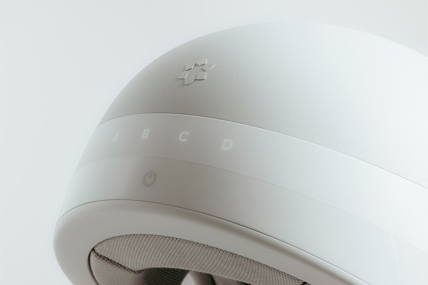 Close-up render of white dome surface showing touch control indicators and icons