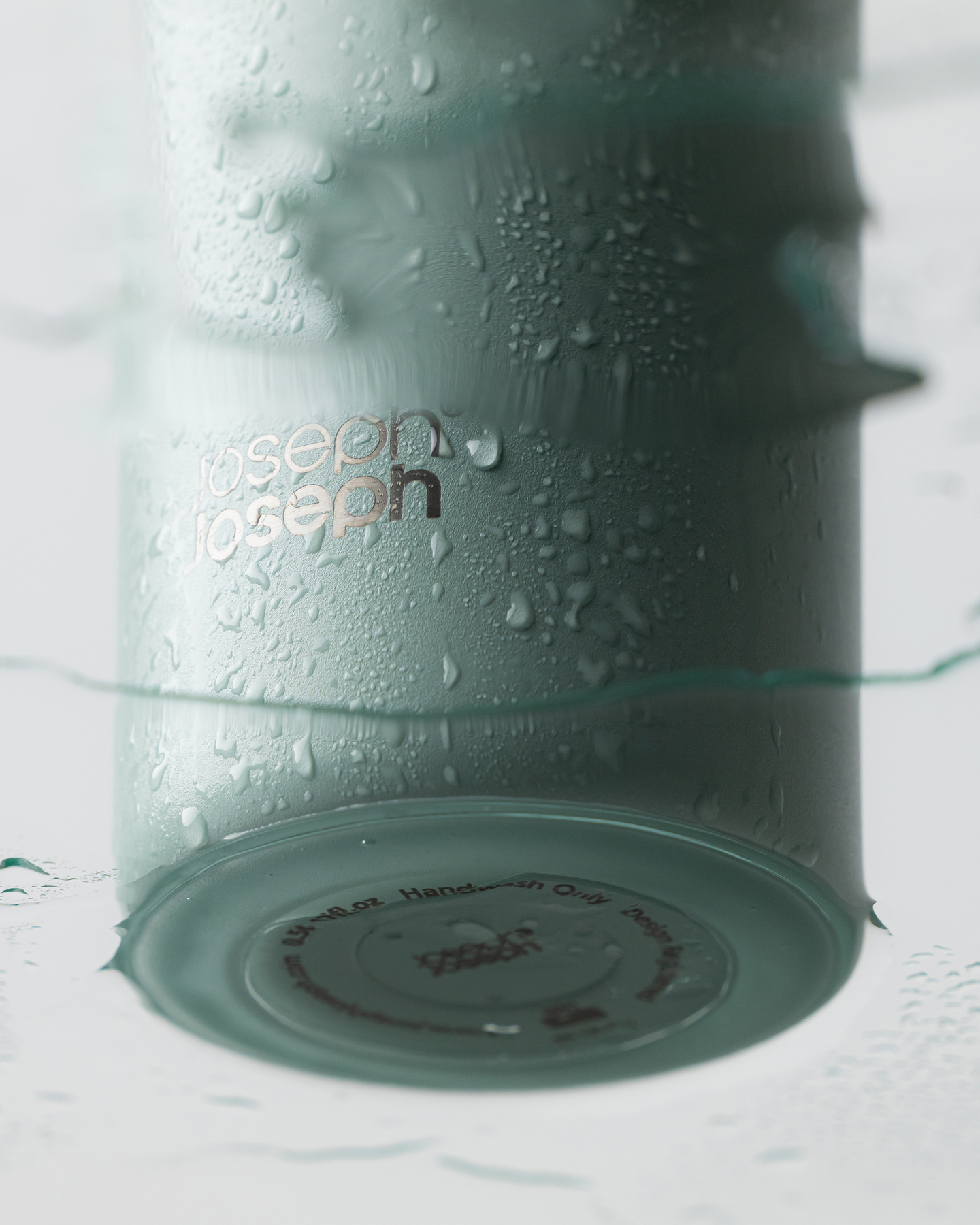 Detailed view of textured surface finish on a green bottle base