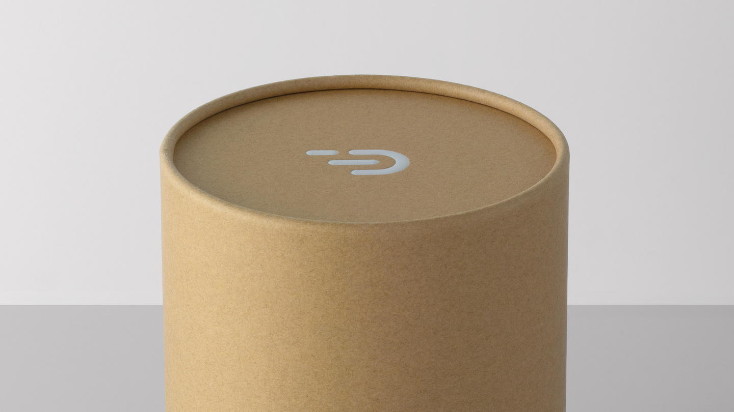 Top view of closed cylindrical cardboard packaging container.